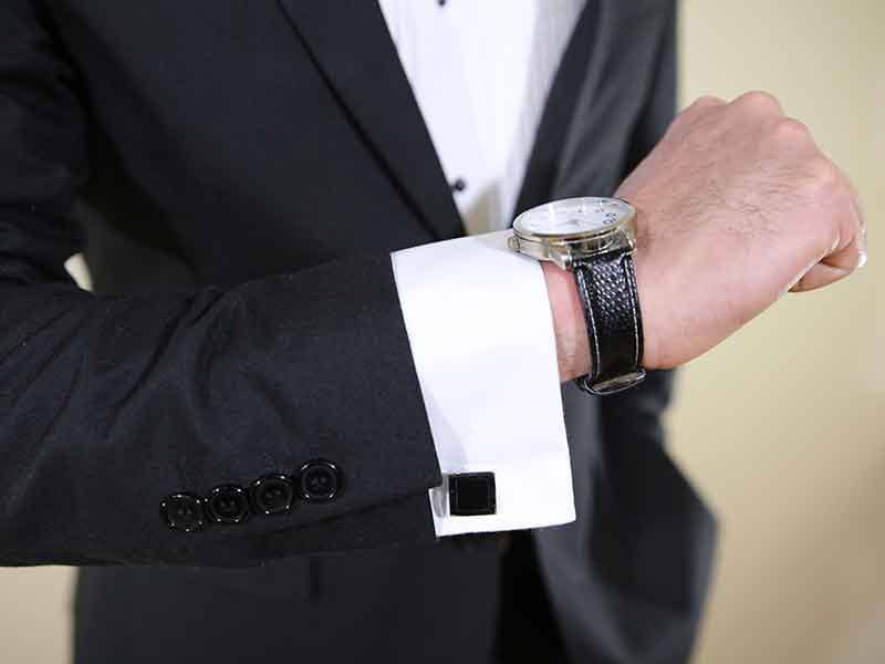 Man's cuff button with watch